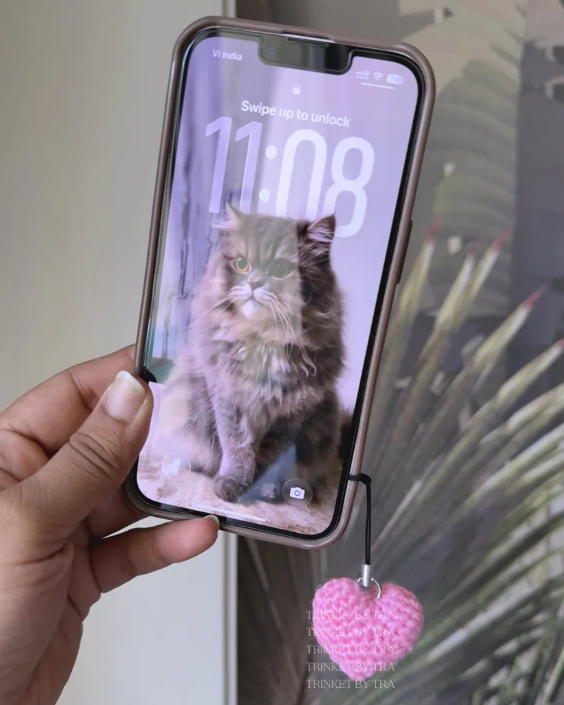 Heart charm on phone.webp