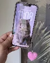 Heart charm on phone.webp